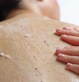 Close up of salt scrub on woman's back