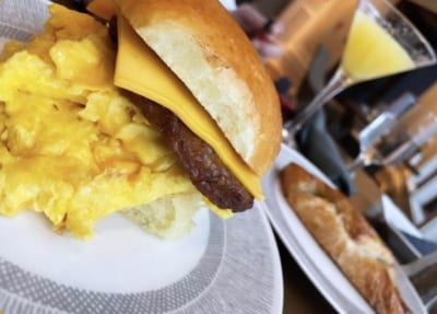 Breakfast sandwich with eggs, sausage and cheese