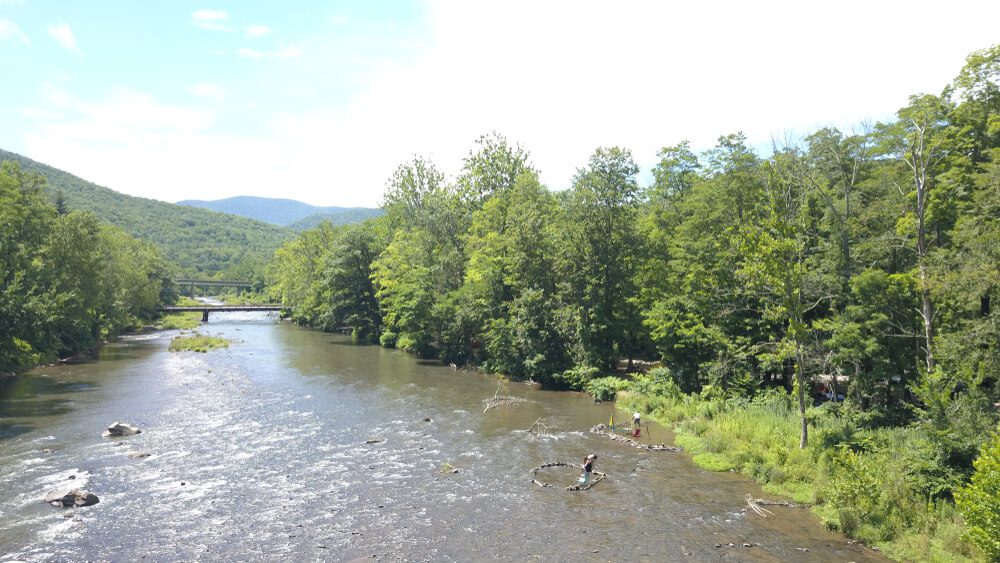 An overhead view of Esopus Creek, which is a top fly fishing spot for those looking for things to do in Phoenicia, NY.
