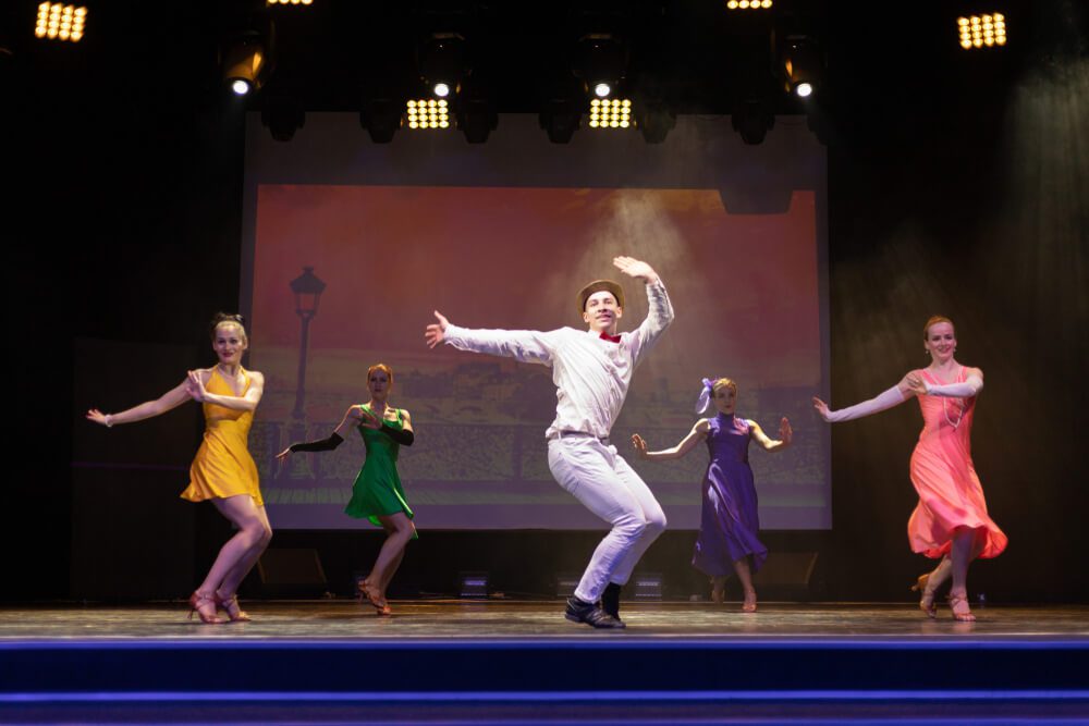 The cast of a musical putting on a show in an Upstate New York performance space.