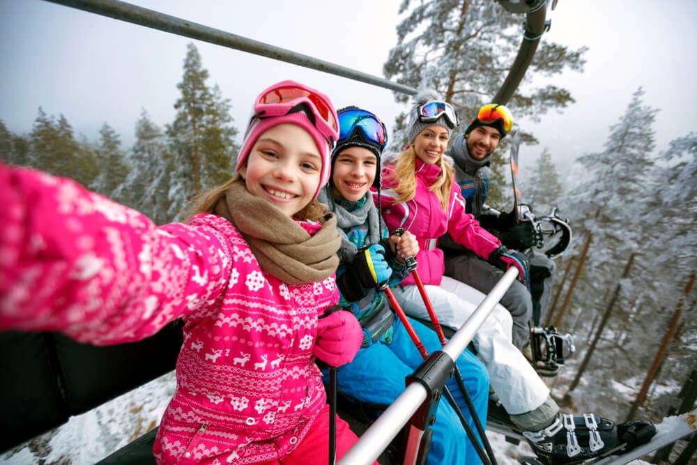 A family skiing during the winter vacation at a Hudson Valley resort.