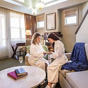 Two women relaxing in an Upstate New York resort on a winter vacation.