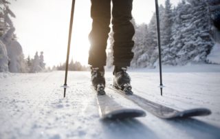 A person cross-country skiing on an Upstate New York winter vacation.