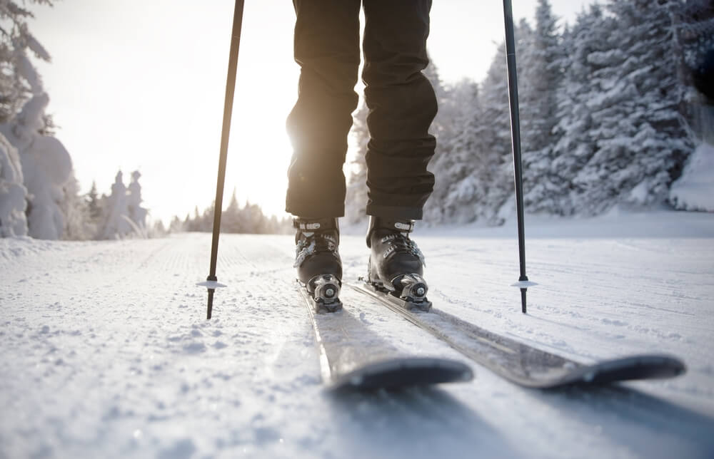 A person cross-country skiing on an Upstate New York winter vacation.