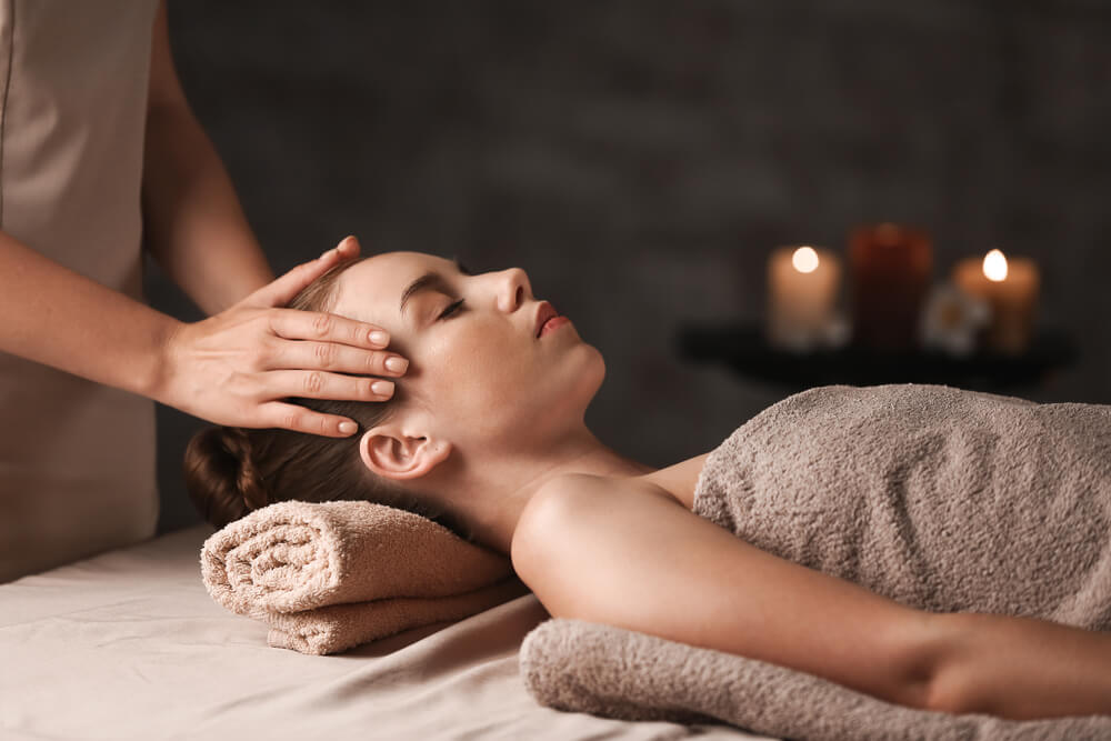A woman getting a massage at a Catskills spa resort.