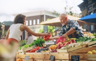 A woman shopping at a Catskill farmers market.