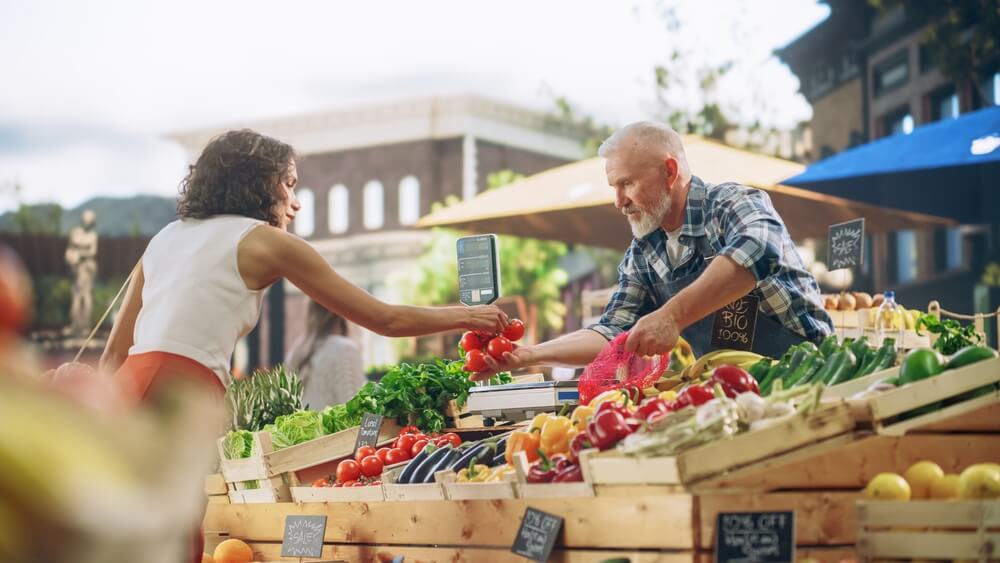 A woman shopping at a Catskill farmers market.